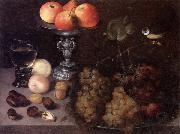 Still life of grapes on a pewter dish,together with peaches,nuts,a glass roemer and a silver tazza containing apples and pears,and a blue-tit Georg Flegel